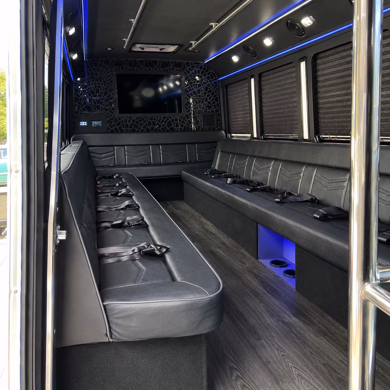Friends laughing during a party bus celebration in Scottsdale